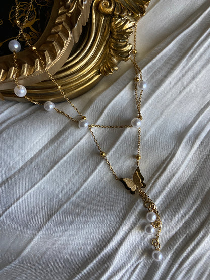 Multilayered gold pearl butterfly necklace