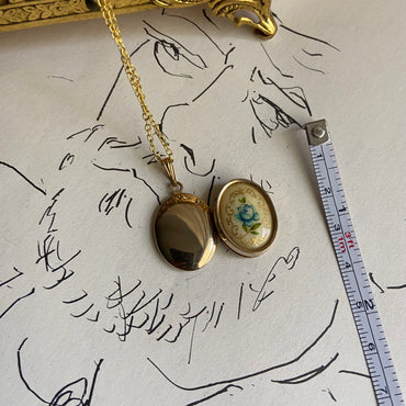 gold dainty flower blue locket   necklace • 18in — Vivian Vintage Collection • only 1 available • View all photos; item is thrifted/vintage and may show flaws: (  )