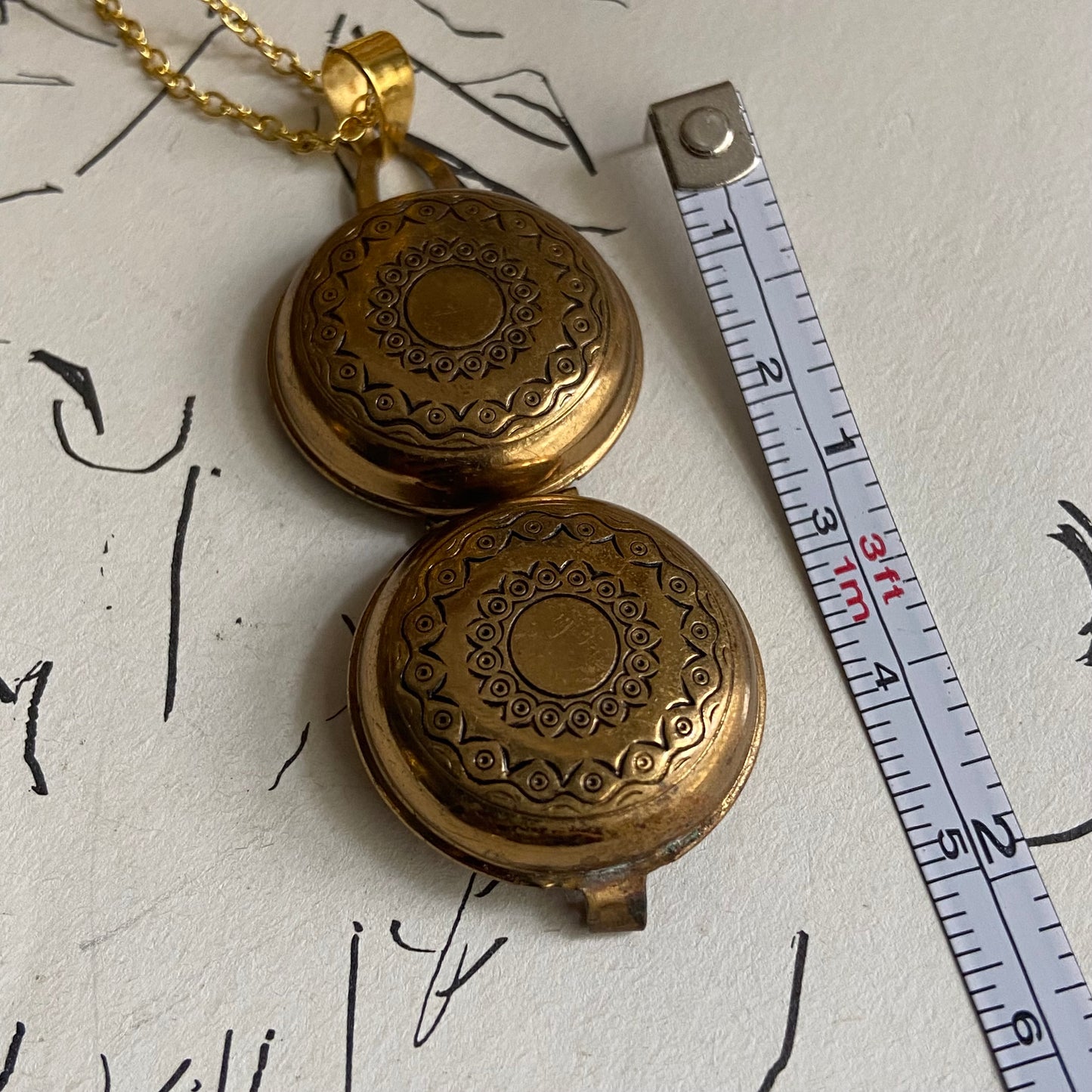 gold engraved circle locket  with photo inside necklace • 18in — Vivian Vintage Collection • only 1 available • View all photos; item is thrifted/vintage and may show flaws: (  )