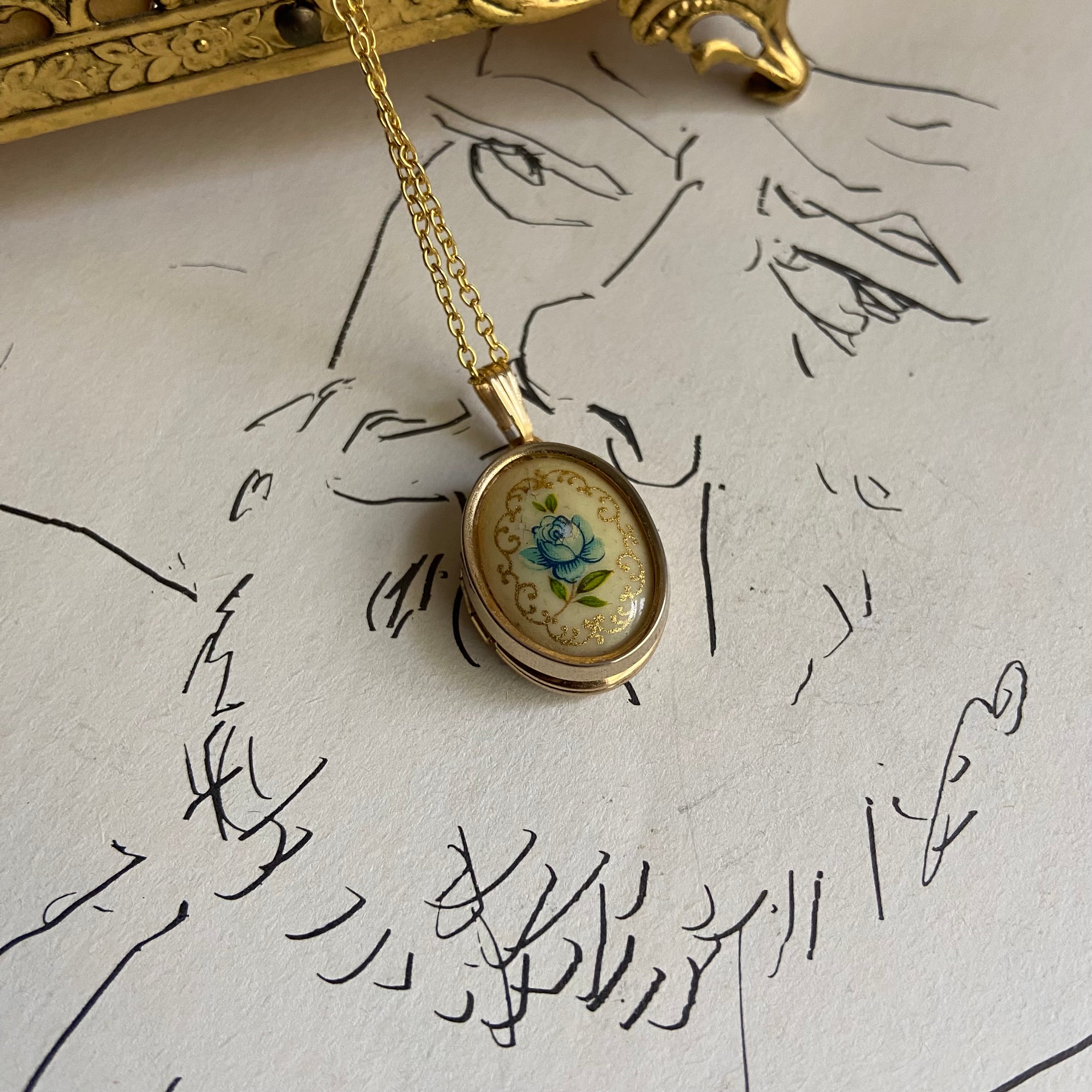 gold dainty flower blue locket   necklace • 18in — Vivian Vintage Collection • only 1 available • View all photos; item is thrifted/vintage and may show flaws: (  )