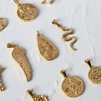 VAIGE Luxurious Gold Stainless Steel Pendant Collection - Unique Designs in Coin, Snake, Eye Feather, Zirconia, Lock, Heart Butterfly