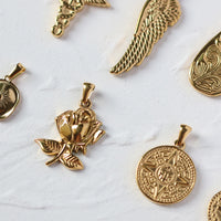 VAIGE Luxurious Gold Stainless Steel Pendant Collection - Unique Designs in Coin, Snake, Eye Feather, Zirconia, Lock, Heart Butterfly